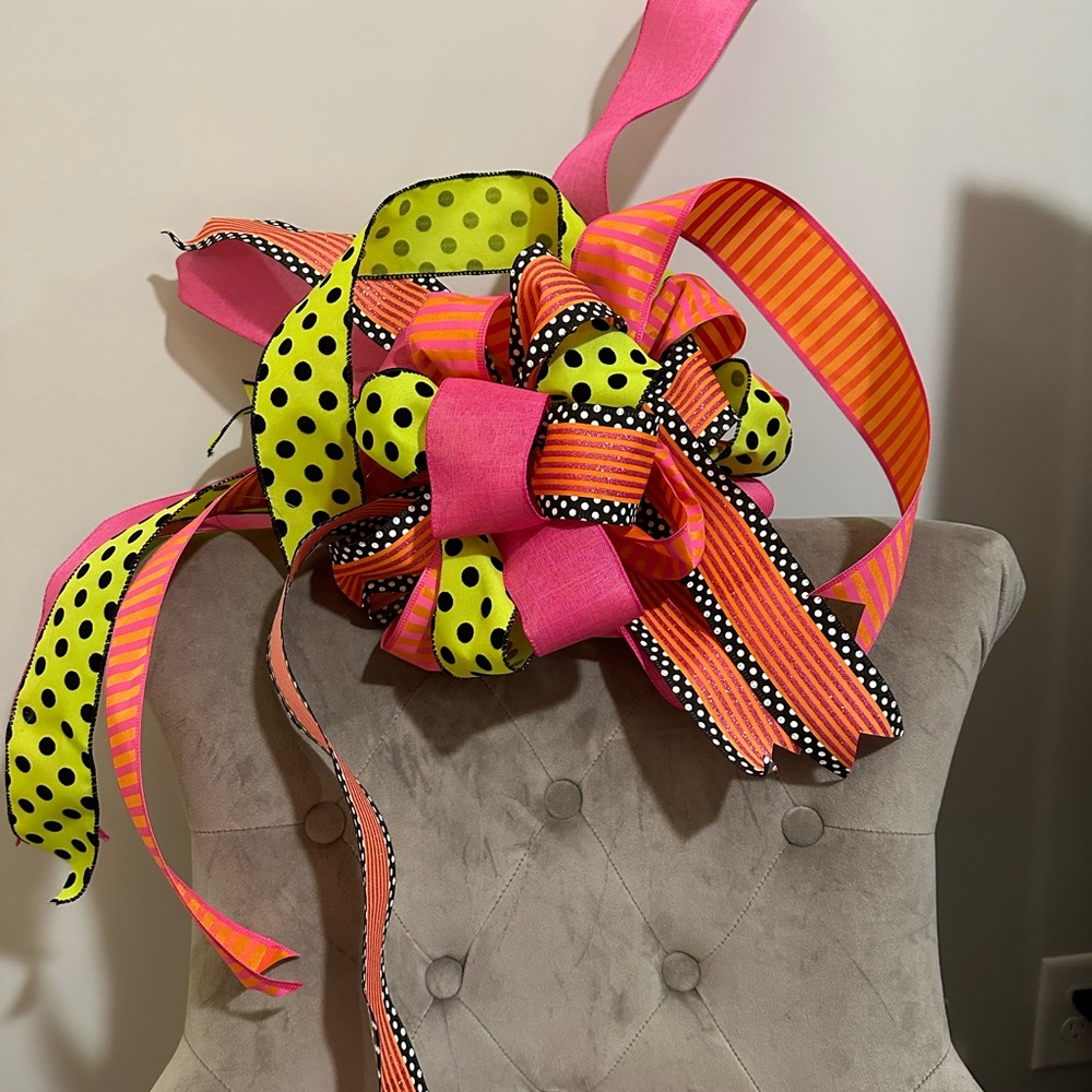 Hand made vibrant chic fall bow in pinks, orange, lime green and black